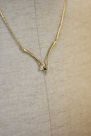 Vintage Goldtone V- shaped Necklace with Green and Rhinestones from Sarah Coventry