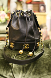 Vintage Chanel Black Caviar Leather Bucket Bag With Golden CC Logo At The Bottom With Original Pouch Inside