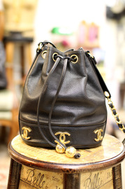 Vintage Chanel Black Caviar Leather Bucket Bag With Golden CC Logo At The Bottom With Original Pouch Inside