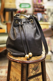 Vintage Chanel Black Caviar Leather Bucket Bag With Golden CC Balls