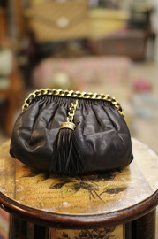 Cutest Vintage Chanel Black Lambskin Pouch with a Tassel and Hidden Leather Strap inside